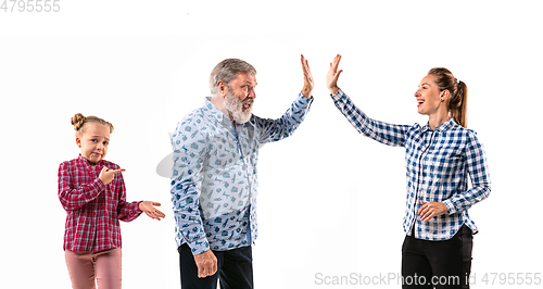 Image of Family members arguing with one another on white studio background.