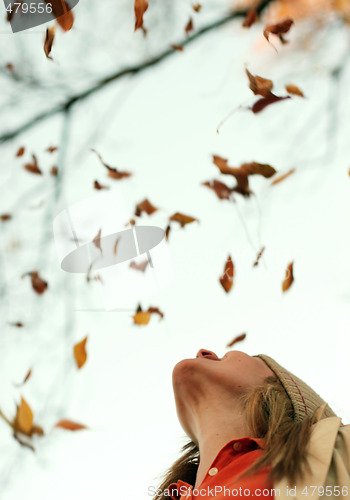 Image of Woman Falling Leaves