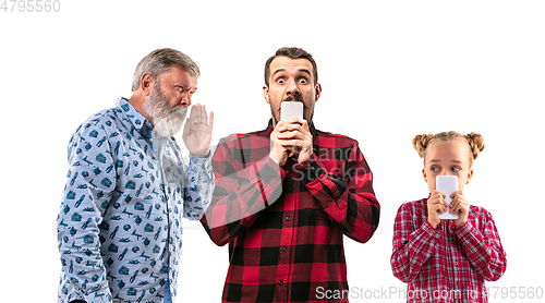 Image of Family members arguing with one another on white studio background.