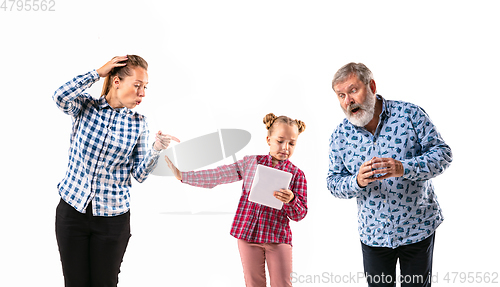 Image of Family members with one another on white studio background.