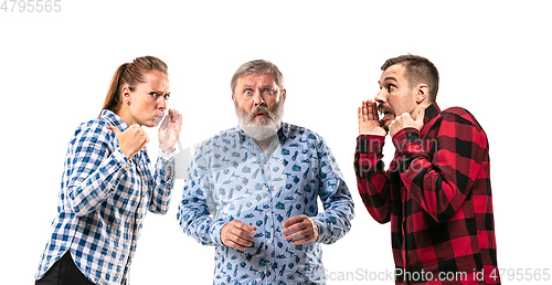 Image of Family members arguing with one another on white studio background.