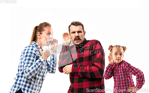 Image of Family members arguing with one another on white studio background.