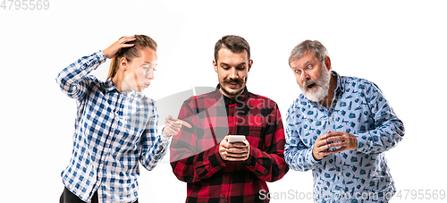 Image of Family members with one another on white studio background.