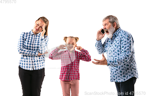 Image of Family members arguing with one another on white studio background.