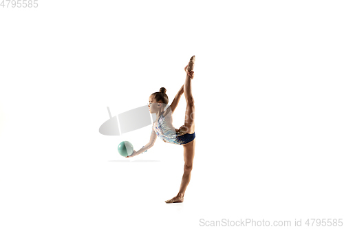 Image of Little flexible female gymnast isolated on white studio background