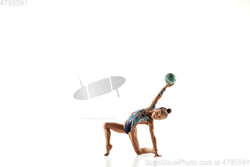 Image of Little flexible female gymnast isolated on white studio background