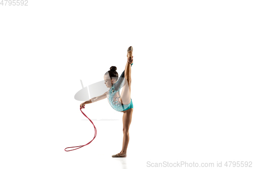 Image of Little flexible female gymnast isolated on white studio background