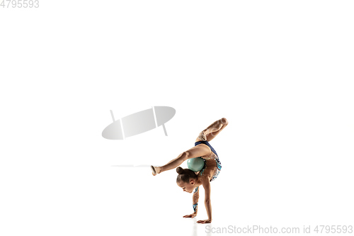 Image of Little flexible female gymnast isolated on white studio background