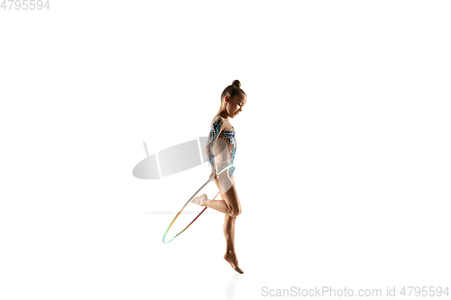 Image of Little flexible female gymnast isolated on white studio background