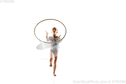 Image of Little flexible female gymnast isolated on white studio background