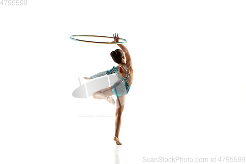 Image of Little flexible female gymnast isolated on white studio background