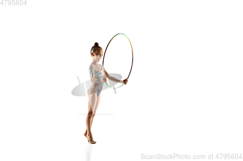 Image of Little flexible female gymnast isolated on white studio background