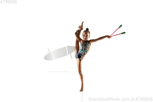Image of Little flexible female gymnast isolated on white studio background