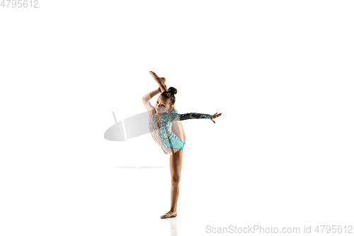 Image of Little flexible female gymnast isolated on white studio background