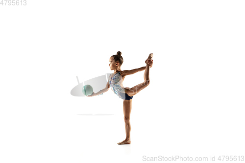 Image of Little flexible female gymnast isolated on white studio background
