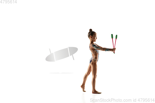 Image of Little flexible female gymnast isolated on white studio background