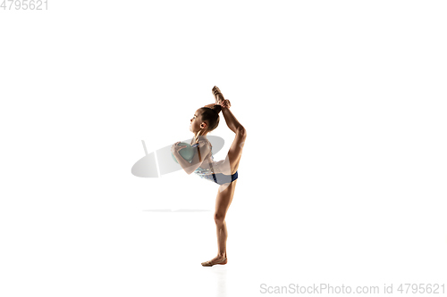 Image of Little flexible female gymnast isolated on white studio background