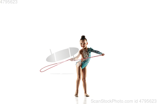 Image of Little flexible female gymnast isolated on white studio background