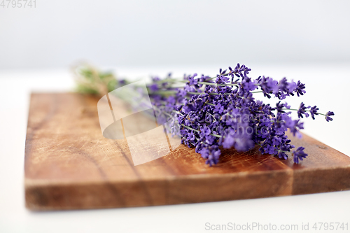 Image of bunch of lavender flowers on wooden board