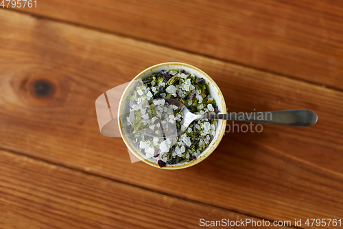 Image of close up of flavored sea salt in bowl with spoon