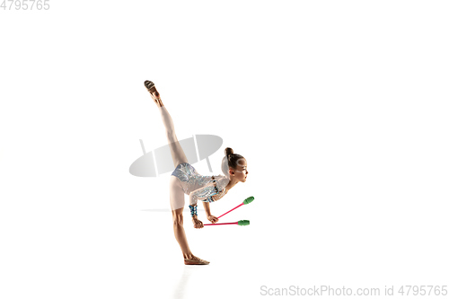 Image of Little flexible female gymnast isolated on white studio background