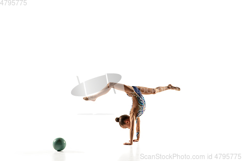 Image of Little flexible female gymnast isolated on white studio background