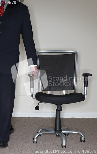 Image of Businessman leading Chair; 