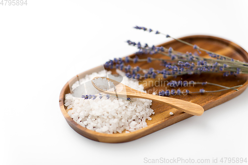 Image of sea salt heap, lavender and spoon on wooden tray