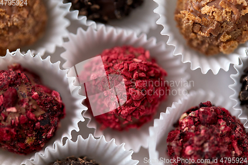 Image of close up of different candies in paper cups