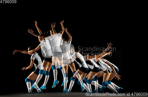 Image of Young female volleyball player isolated on black studio background