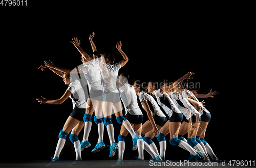 Image of Young female volleyball player isolated on black studio background