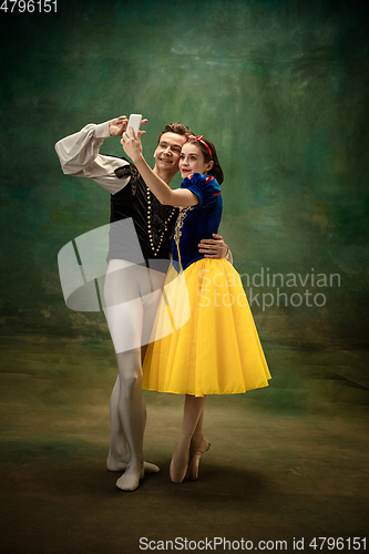 Image of Young ballet dancers as a Snow White\'s characters in forest modern tales