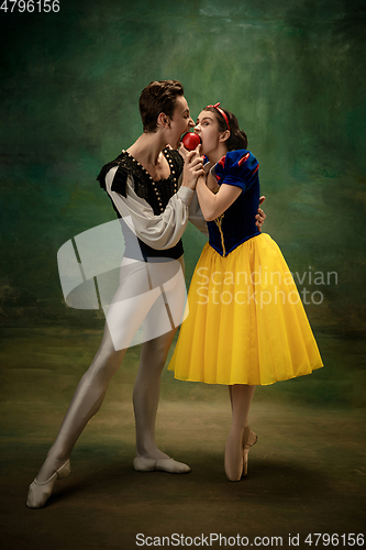 Image of Young ballet dancers as a Snow White\'s characters in forest modern tales