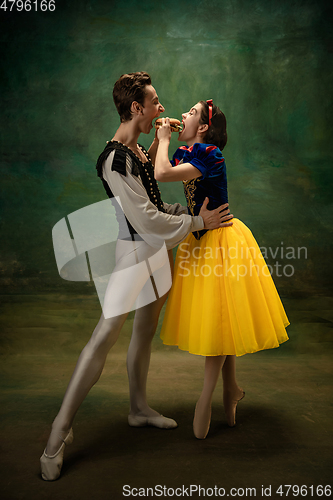 Image of Young ballet dancers as a Snow White\'s characters in forest, modern tales