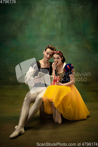 Image of Young ballet dancers as a Snow White\'s characters in forest modern tales