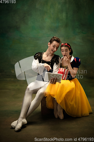 Image of Young ballet dancers as a Snow White\'s characters in forest modern tales