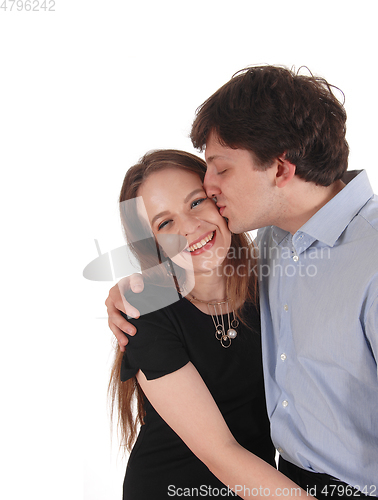 Image of Handsome man kissing his girlfriend