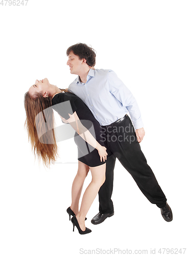 Image of Dancing young couple over white