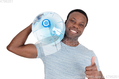 Image of Smiling African man delivering fresh water