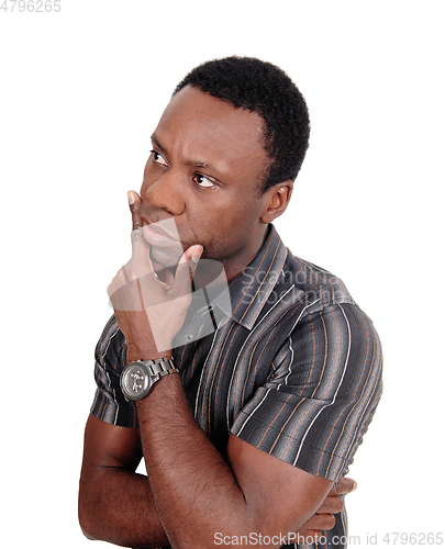 Image of Portrait of thinking African man with hand on chin