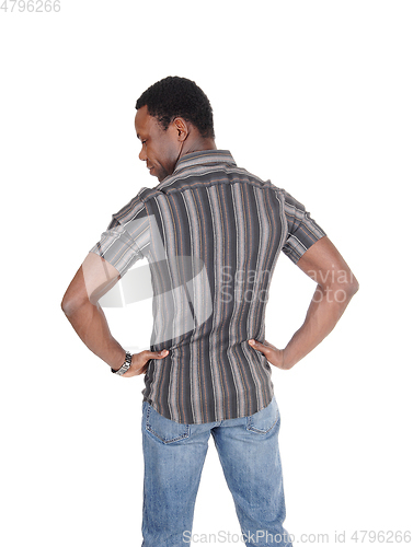 Image of Handsome tall African man standing from back