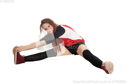 Image of Young woman doing gymnastics on floor