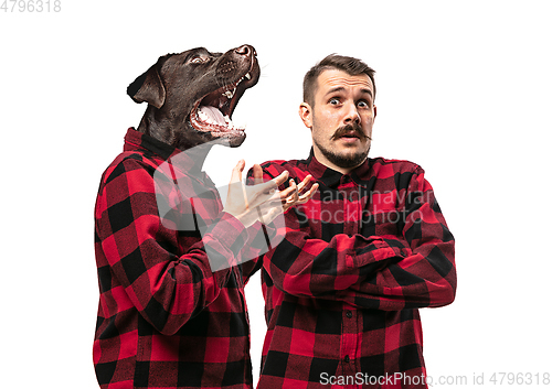 Image of Man arguing with himself as a dog on white studio background.