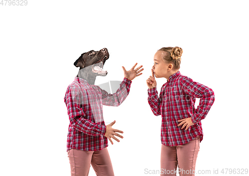 Image of Young handsome girl arguing with herself as a dog on white studio background.