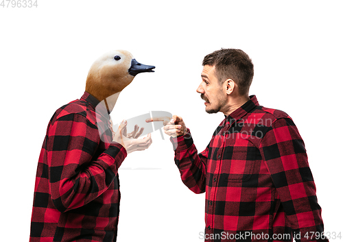 Image of Man arguing with himself as a goose on white studio background.