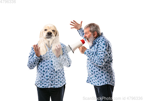 Image of Senior man arguing with himself as a dog on white studio background.