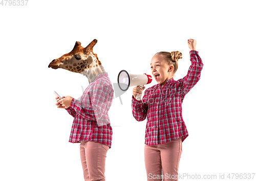 Image of Young handsome girl arguing with herself as a giraffe on white studio background.
