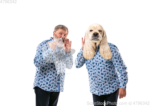 Image of Senior man arguing with himself as a dog on white studio background.