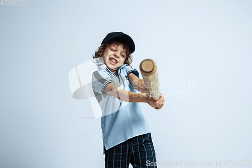 Image of Pretty young boy in casual clothes on white studio background