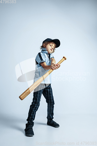 Image of Pretty young boy in casual clothes on white studio background